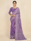 Front view of a model wearing a Purple Printed Georgette Saree with an elegant traditional border, showcasing the graceful drape and vibrant print for daily wear.