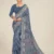 Front view of a model in a Navy Blue Printed Georgette Saree with a traditional woven border, featuring elegant floral prints. A perfect lightweight saree for office wear and professional gatherings.