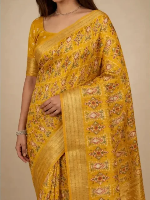 Detailed macro closeup of the Mustard Yellow Printed Georgette Saree fabric and zari border. Showcases the high-quality print detail and the fine craftsmanship of the traditional border.