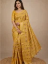 Front view of a model in a vibrant Mustard Yellow Printed Georgette Saree with a traditional woven border. Features intricate floral prints, making it an ideal choice for Haldi ceremonies and festive wear.